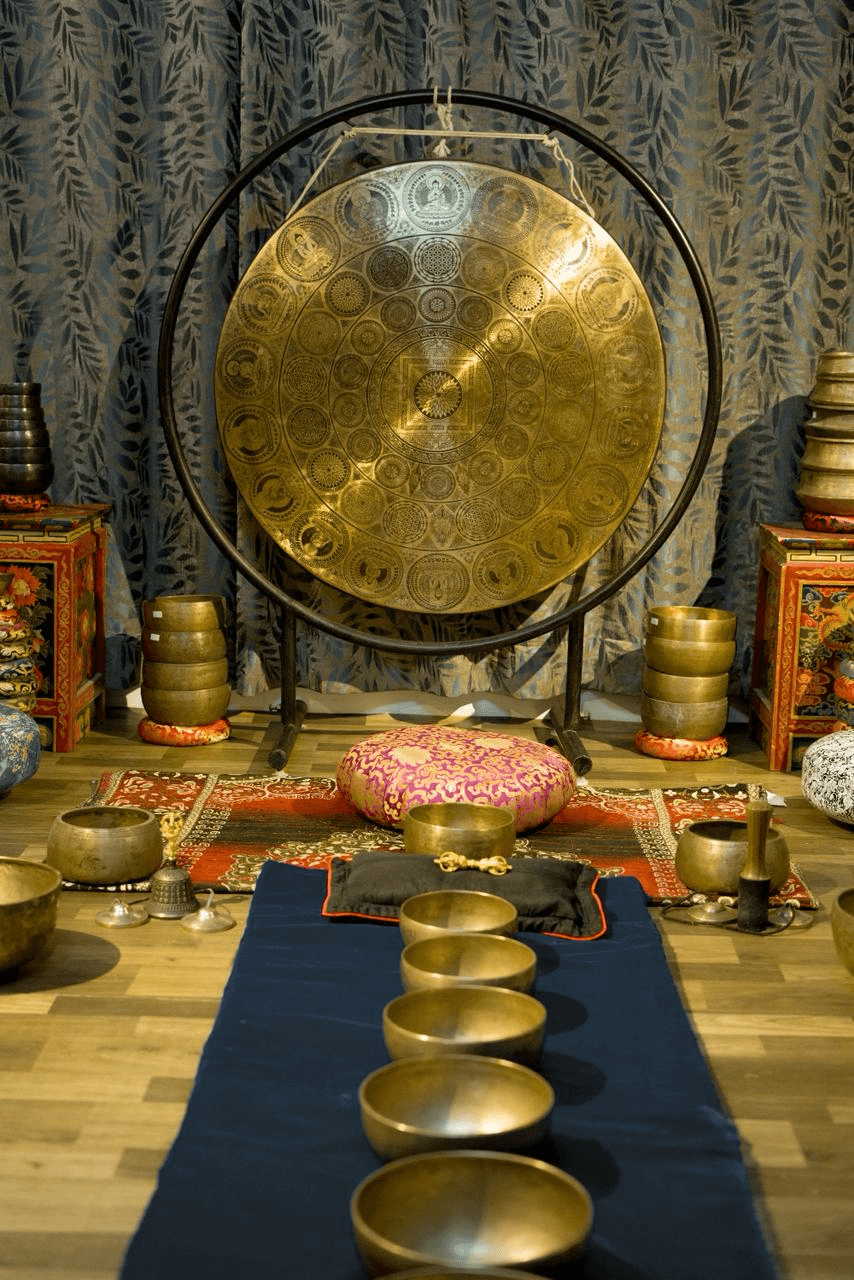 Detailed close-up of a healing gong with ritual setup