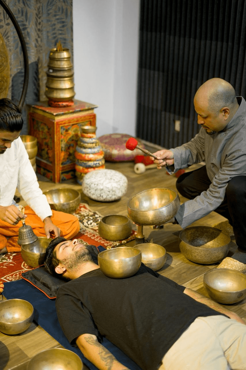 Sound healer performing a bowl meditation session